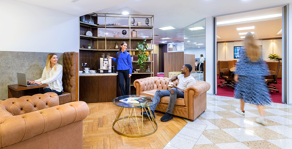 Clients networking while enjoying a cup of coffee in 1 Mayfair Place 5-star Coworking Space. 